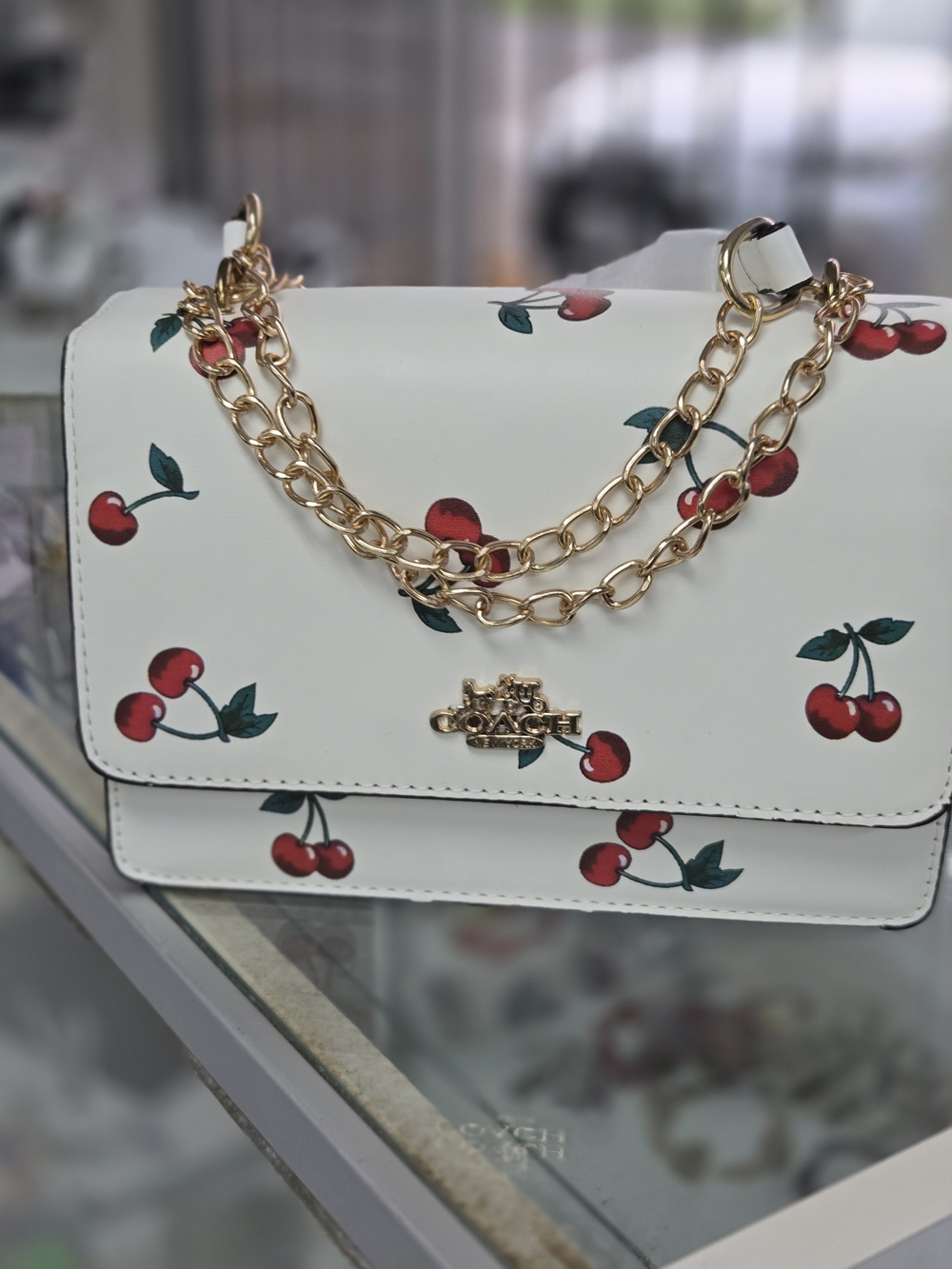 Coach White Leather Crossbody with Red Cherry Print & Gold Chain Detail